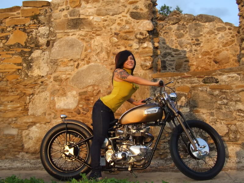 Woman with a vintage motorcycle