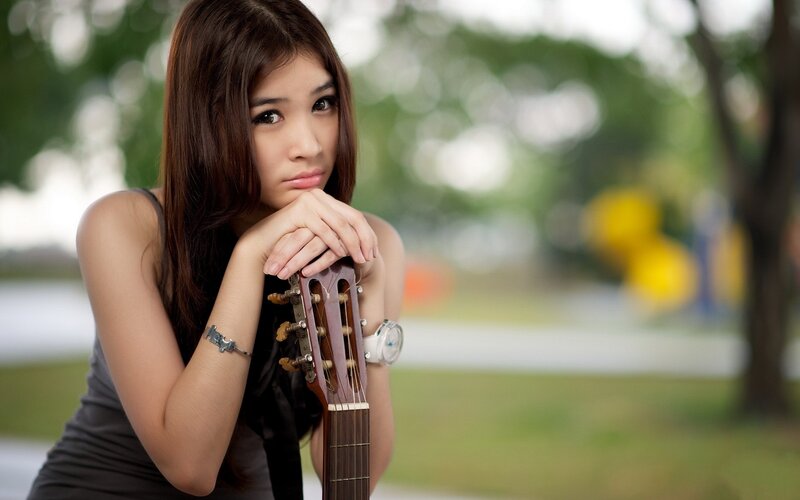 woman with acoustic guitar
