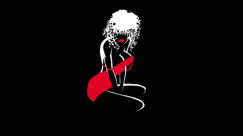woman with afro in red outfit
