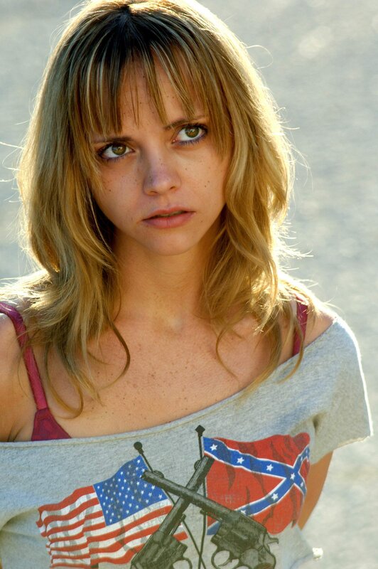 woman with american and confederate flags