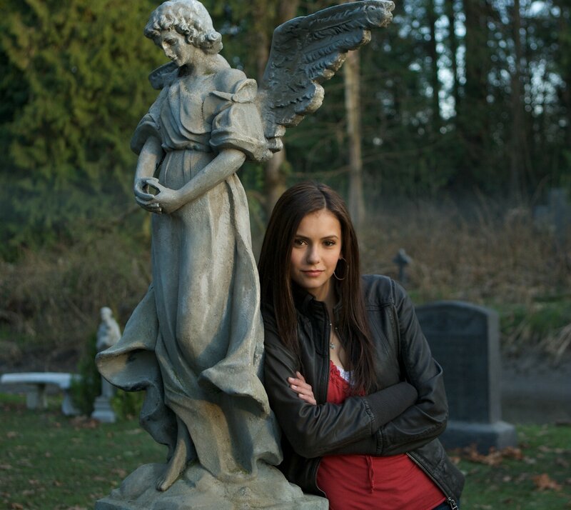 woman with angel statue