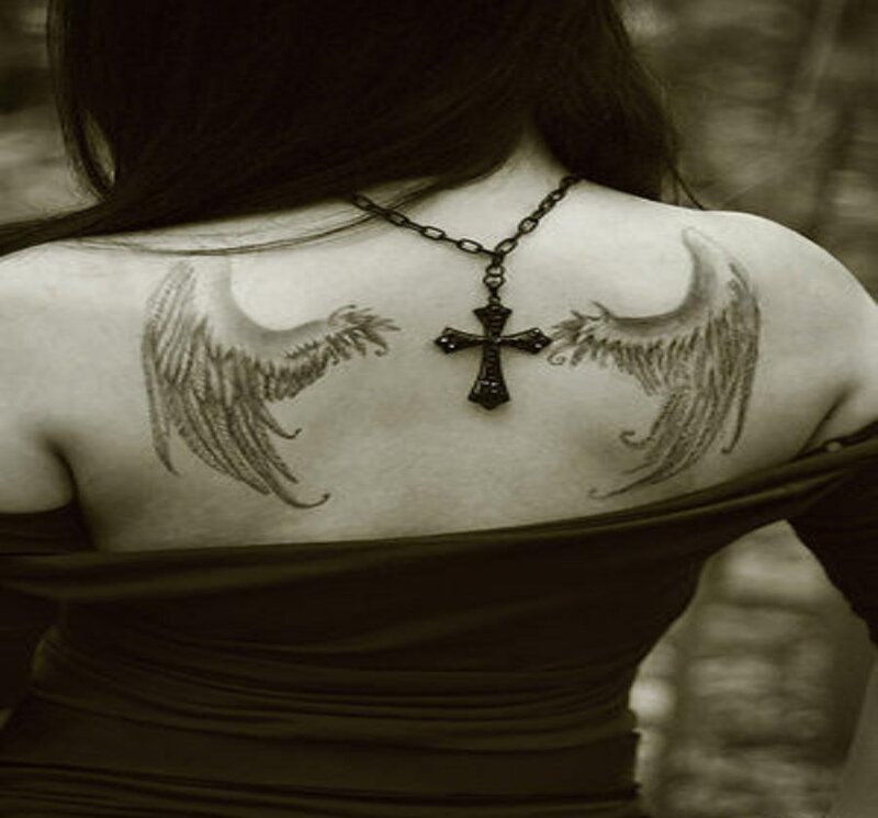 woman with angel wing tattoos