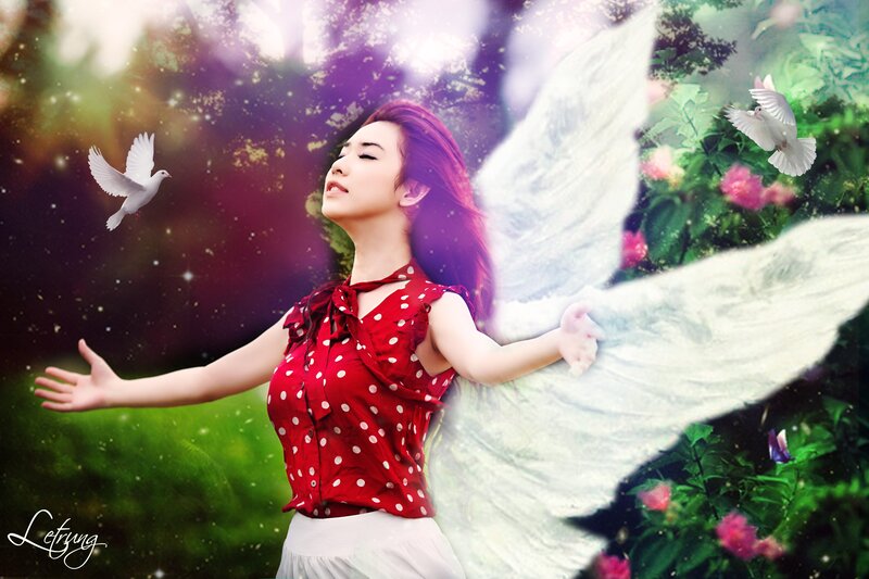 woman with angel wings and doves