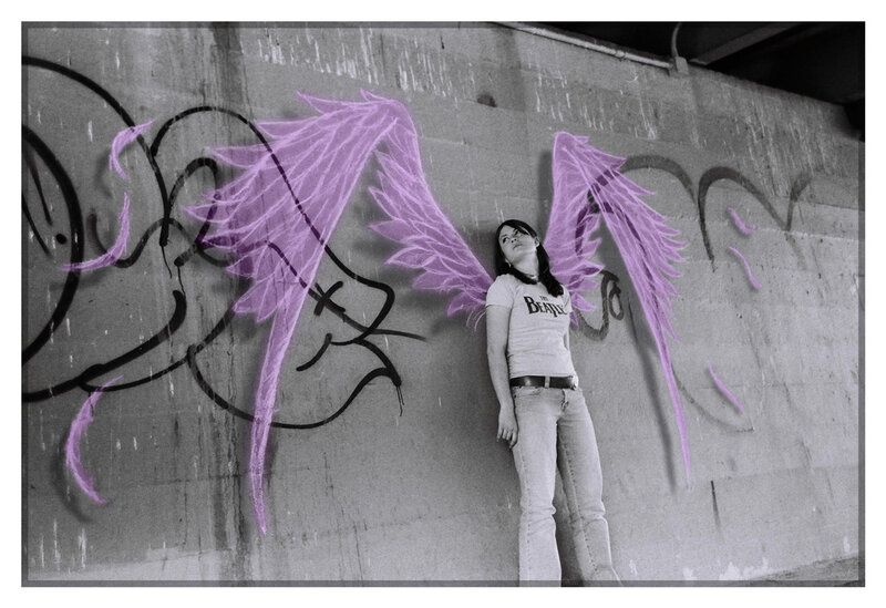 woman with angel wings graffiti
