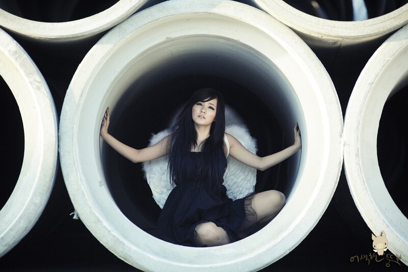 woman with angel wings in pipe