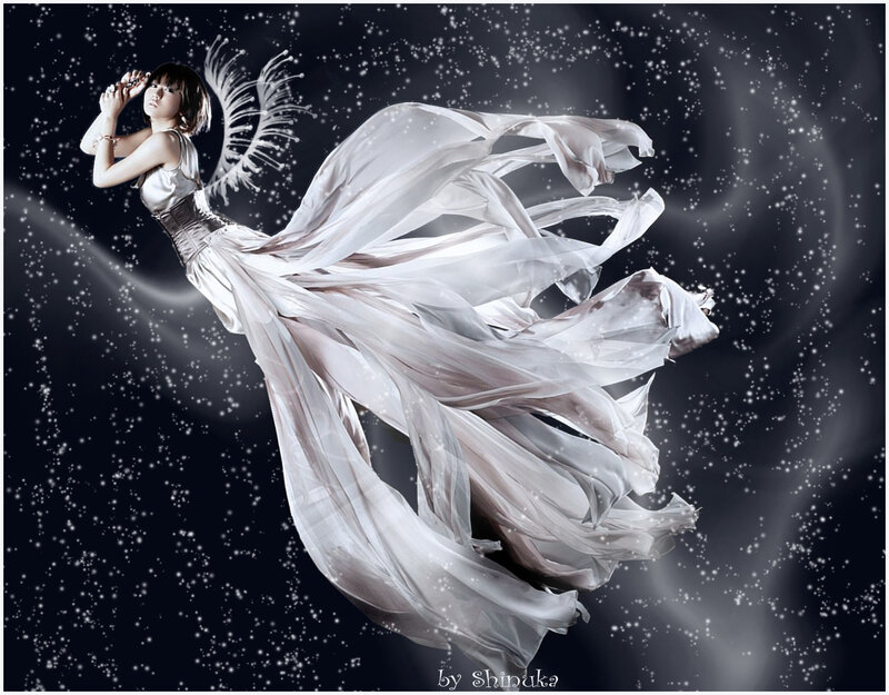 woman with angel wings in white dress