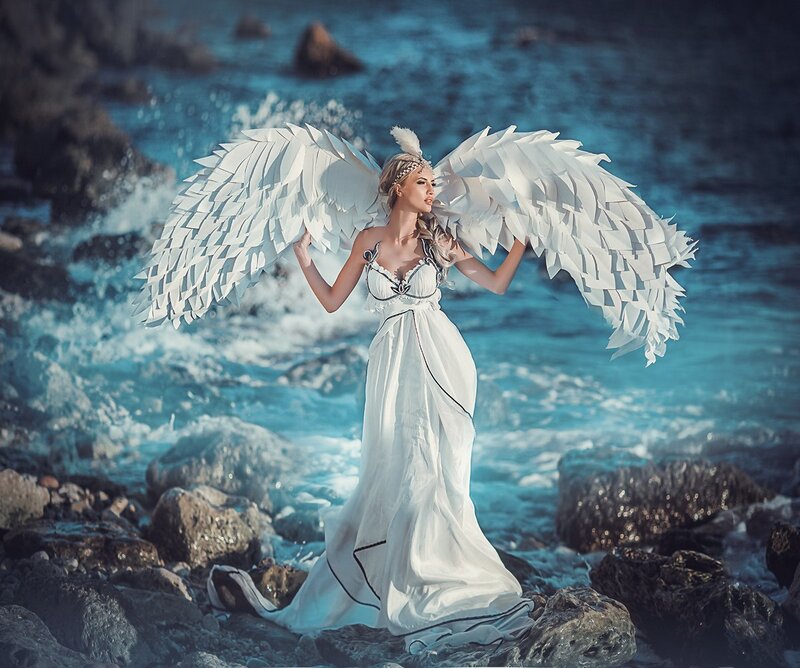 Woman with Angel Wings — White, Dramatic, Afternoon, Photograph, Ocean