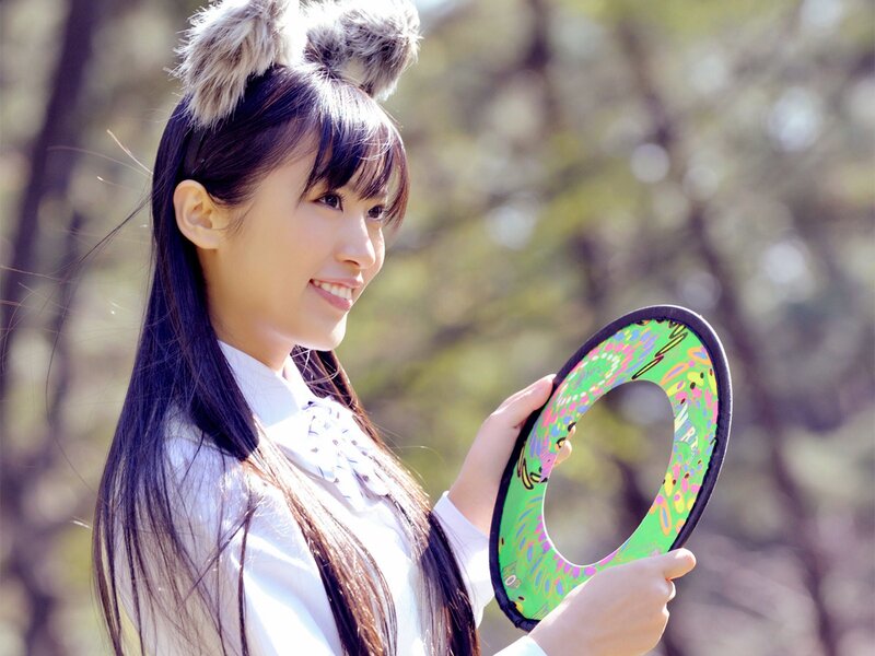 Woman with animal ears holding a frisbee