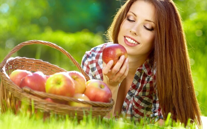 Woman with apples in a basket