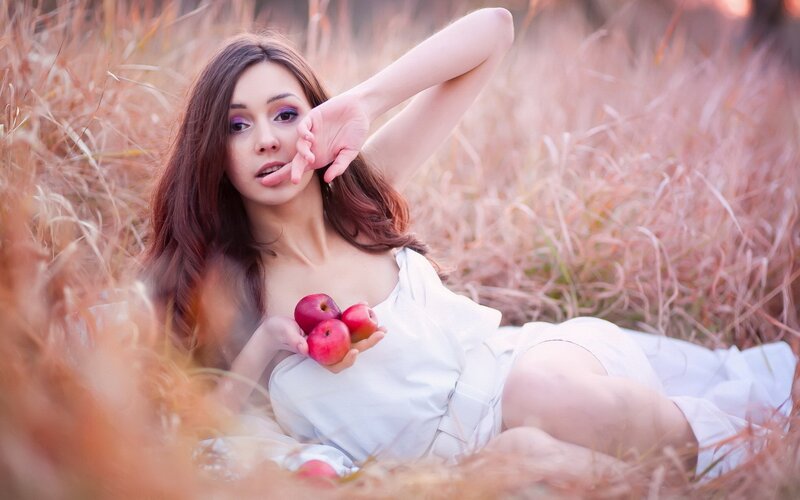 woman with apples in field