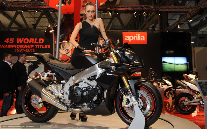 Woman with Aprilia motorcycle