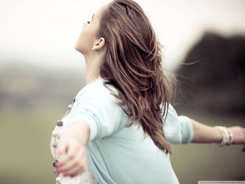 woman with arms outstretched