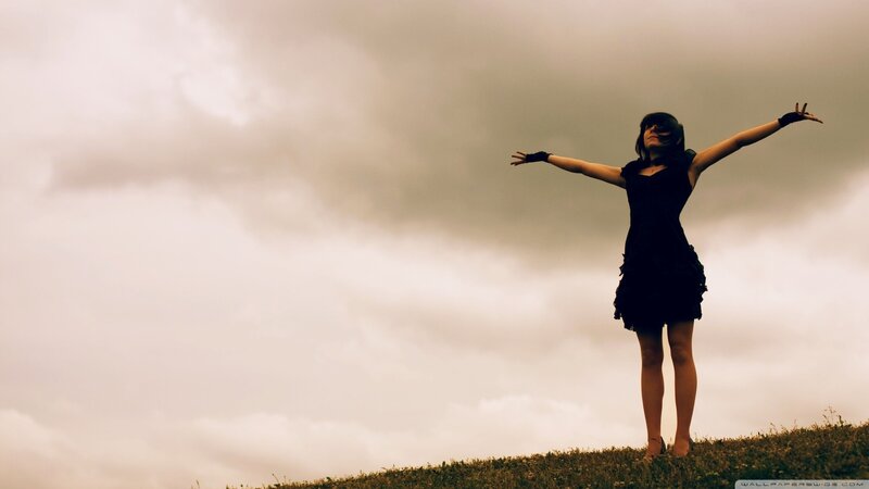woman with arms outstretched
