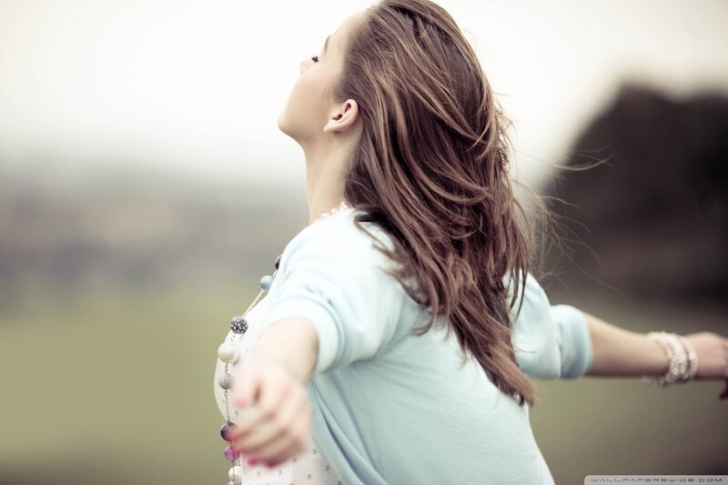 woman with arms outstretched