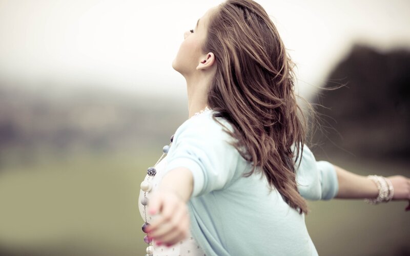 woman with arms outstretched