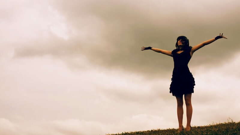 woman with arms outstretched