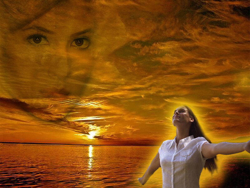 woman with arms outstretched at sunset