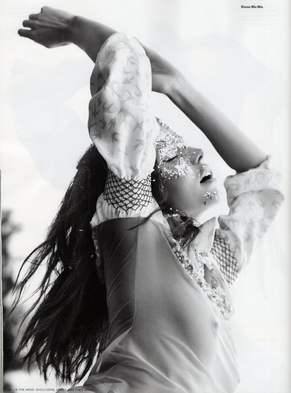 woman with arms raised