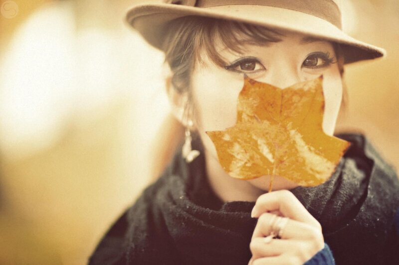 woman with autumn leaf