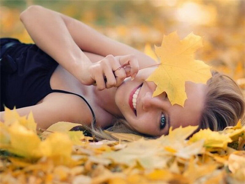 woman with autumn leaf