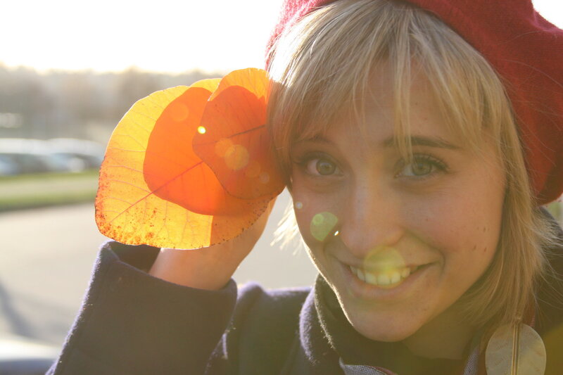 woman with autumn leaf
