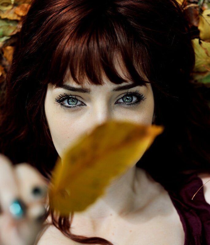 woman with autumn leaf