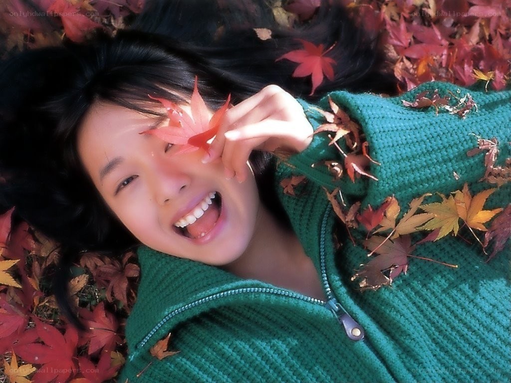 woman with autumn leaf