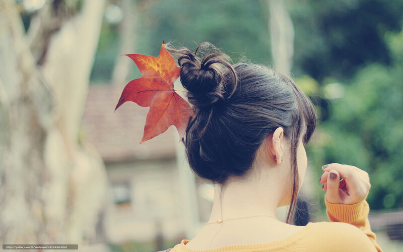 woman with autumn leaf in hair