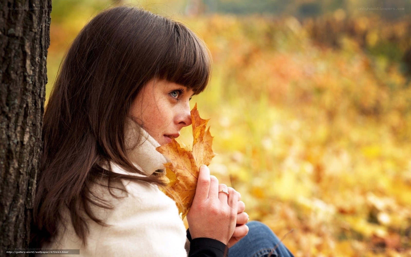 woman with autumn leaf