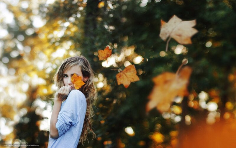 woman with autumn leaves