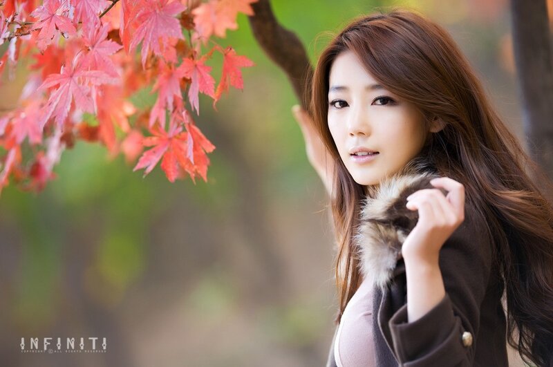woman with autumn leaves