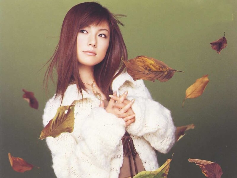 woman with autumn leaves