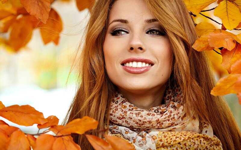 woman with autumn leaves