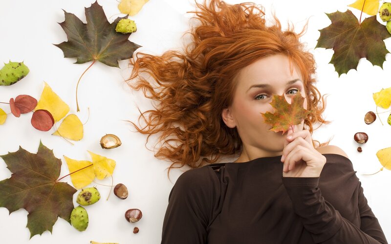 woman with autumn leaves
