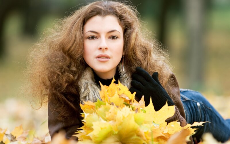 woman with autumn leaves