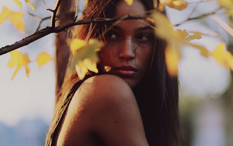 woman with autumn leaves