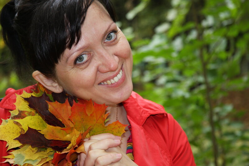 woman with autumn leaves