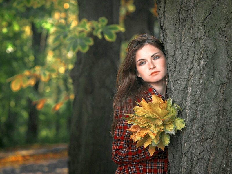 woman with autumn leaves