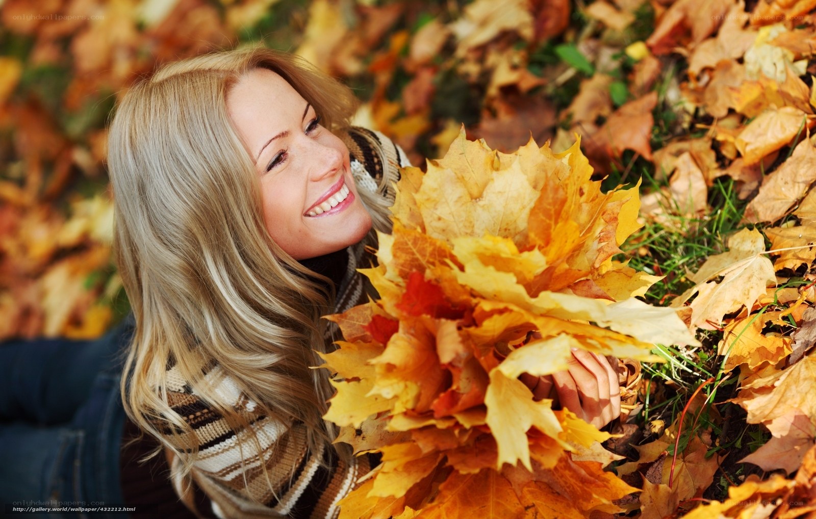 Woman with autumn leaves