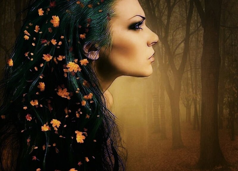 woman with autumn leaves in hair