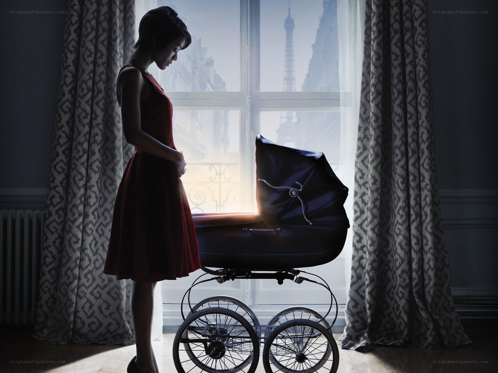 Woman with baby carriage in Paris