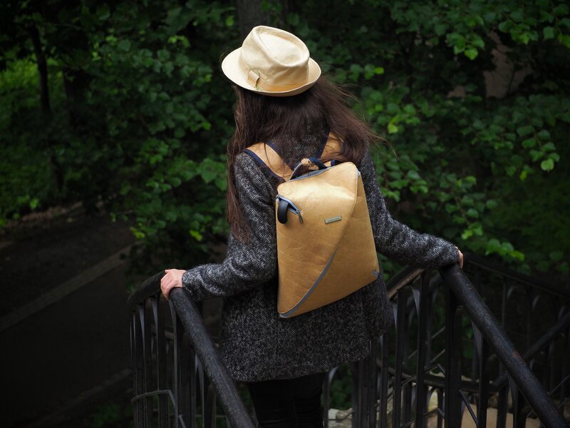 Woman with backpack on bridge
