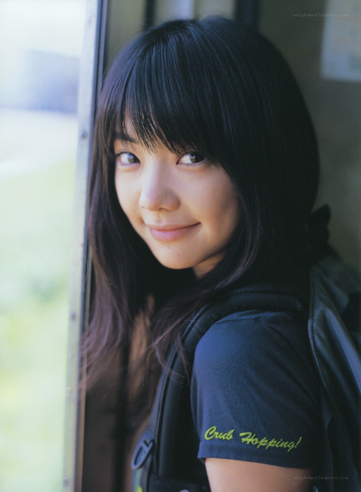 woman with backpack smiling