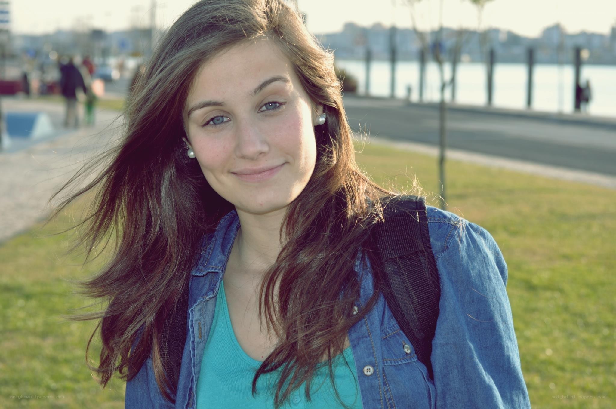 woman with backpack smiling
