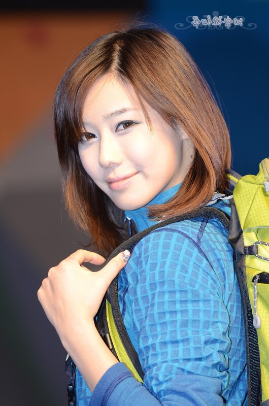 woman with backpack smiling
