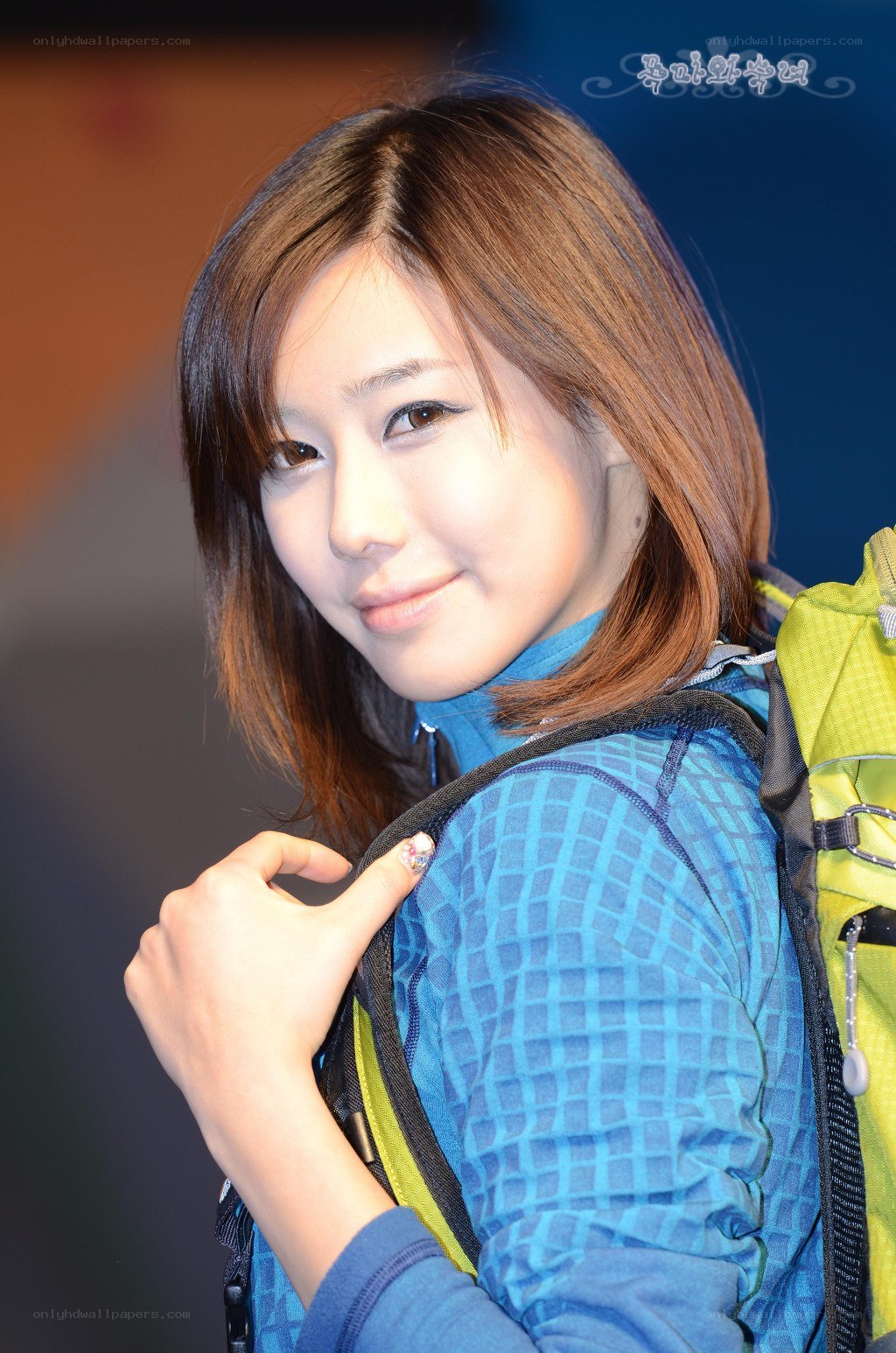woman with backpack smiling