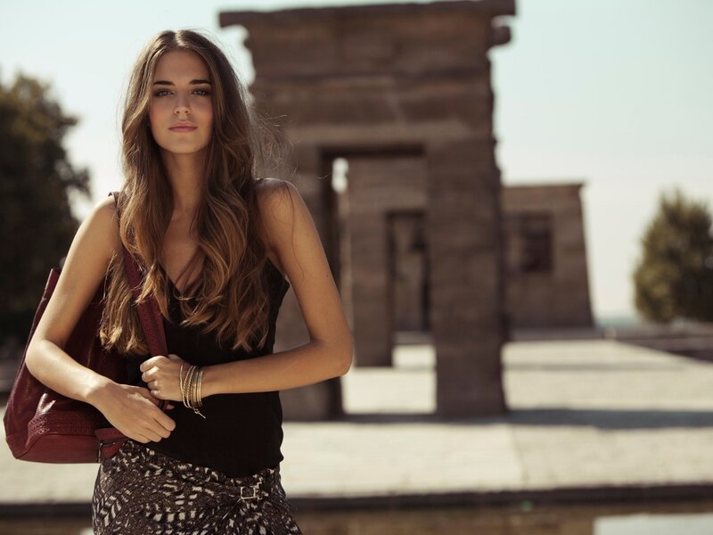 woman with bag in ancient setting