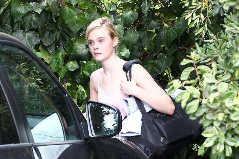 woman with bag near car