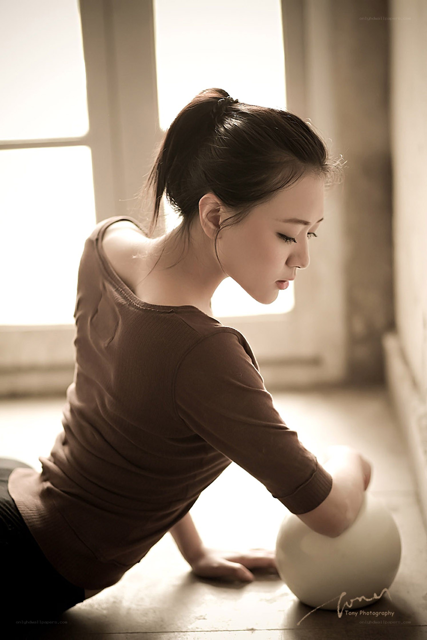 woman with ball in studio