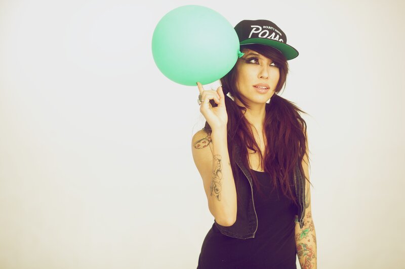 woman with balloon and cap